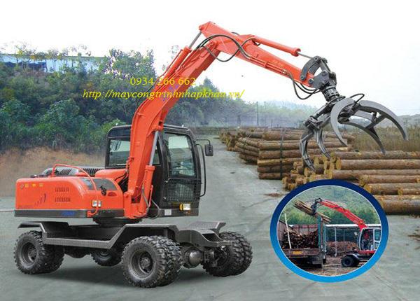 Máy xúc đào bánh lốp gắp (kẹp) gỗ mới